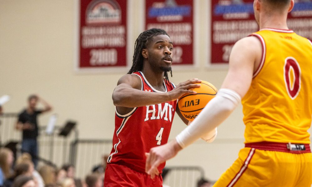 Robert Morris guard Josh Omojafo looks to pass the ball against IU Indy -- RMU Athletics