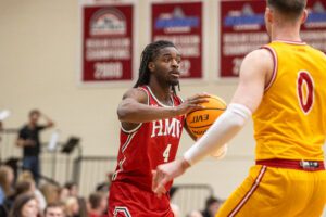 Robert Morris guard Josh Omojafo looks to pass the ball against IU Indy -- RMU Athletics
