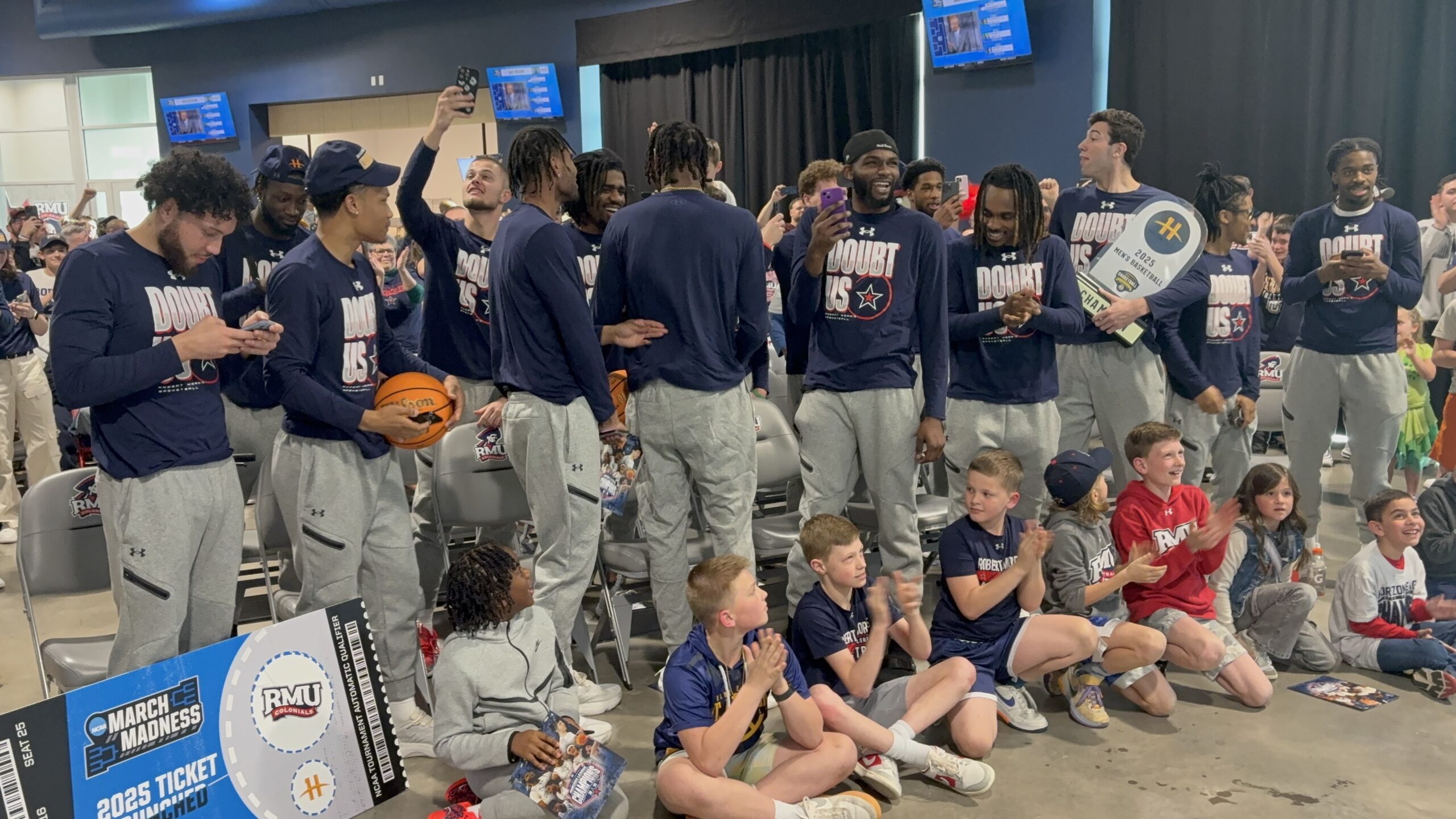 Robert Morris celebrates after earning the No. 15 seed in the NCAA Tournament on March 16, 2025