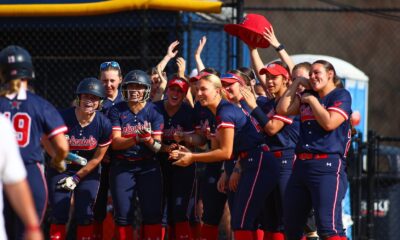 Robert Morris' softball team celebrates a home run -- RMU Athletics