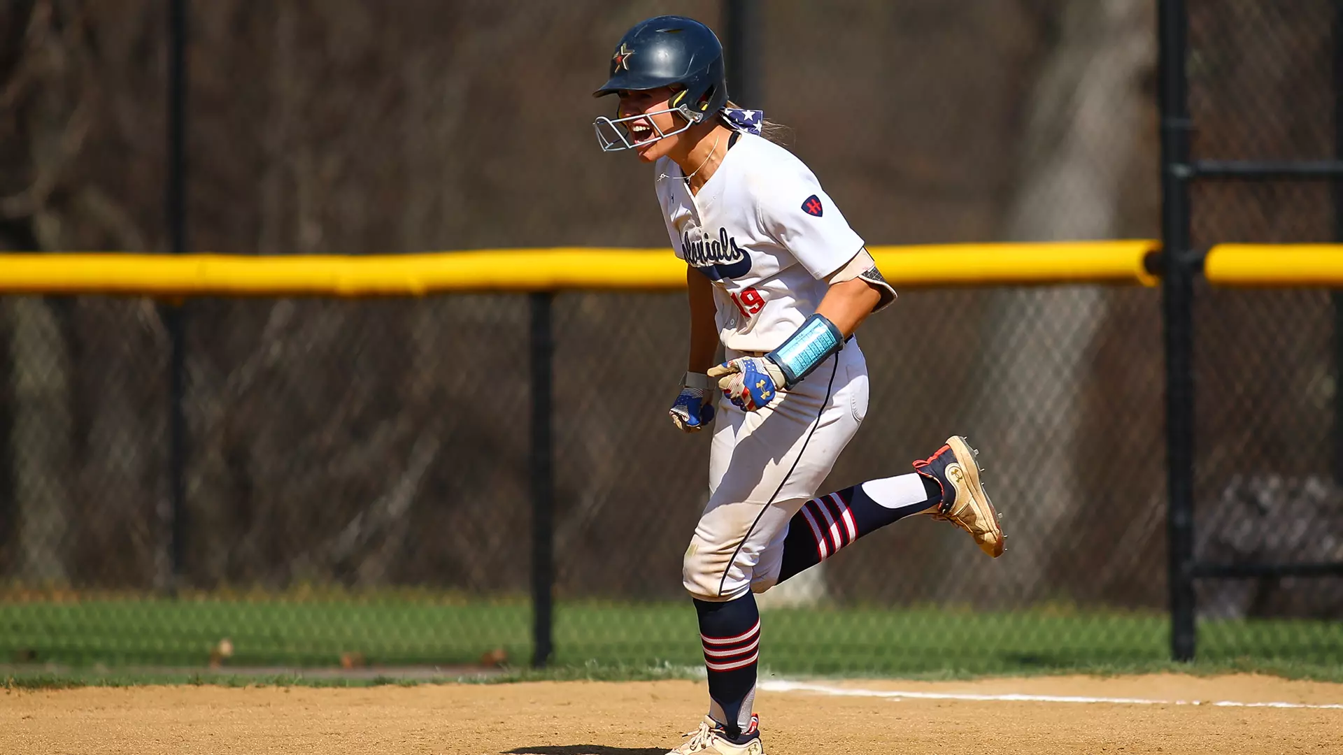 Robert Morris outfielder Courtney Poulich after a home run -- RMU Athletics