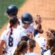 Robert Morris softball celebrates a home run against Auburn in the NCAA Tournament regionals -- RMU Athletics