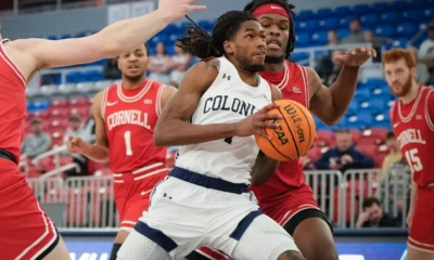 Robert Morris guard Justice Williams drives towards the basket against Cornell during the 2023-24 season -- RMU athletics