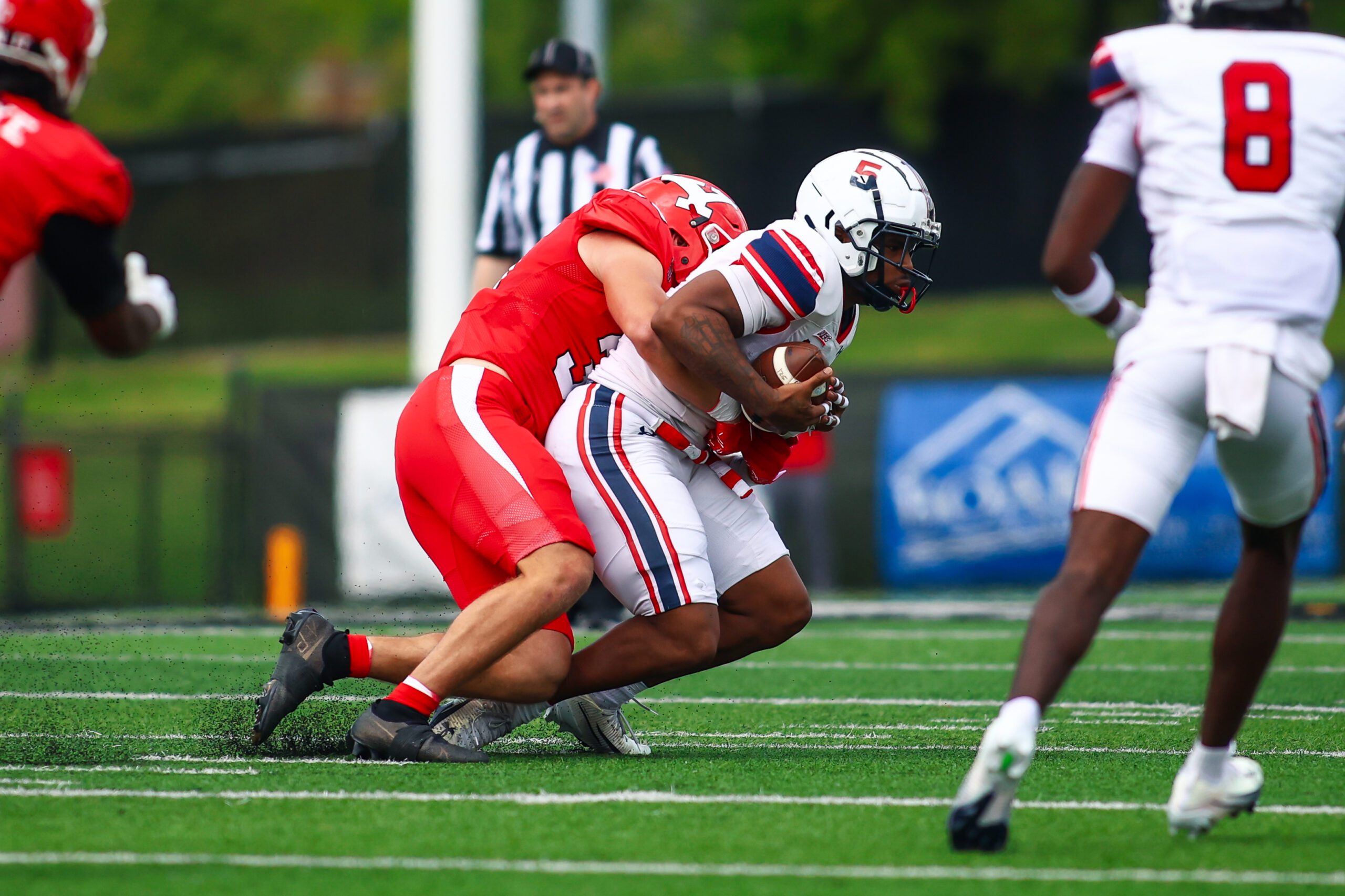 Robert Morris running back Donta Whack is tackled during a game against Youngstown St. on Sept. 6, 2025 -- RMU Athletics