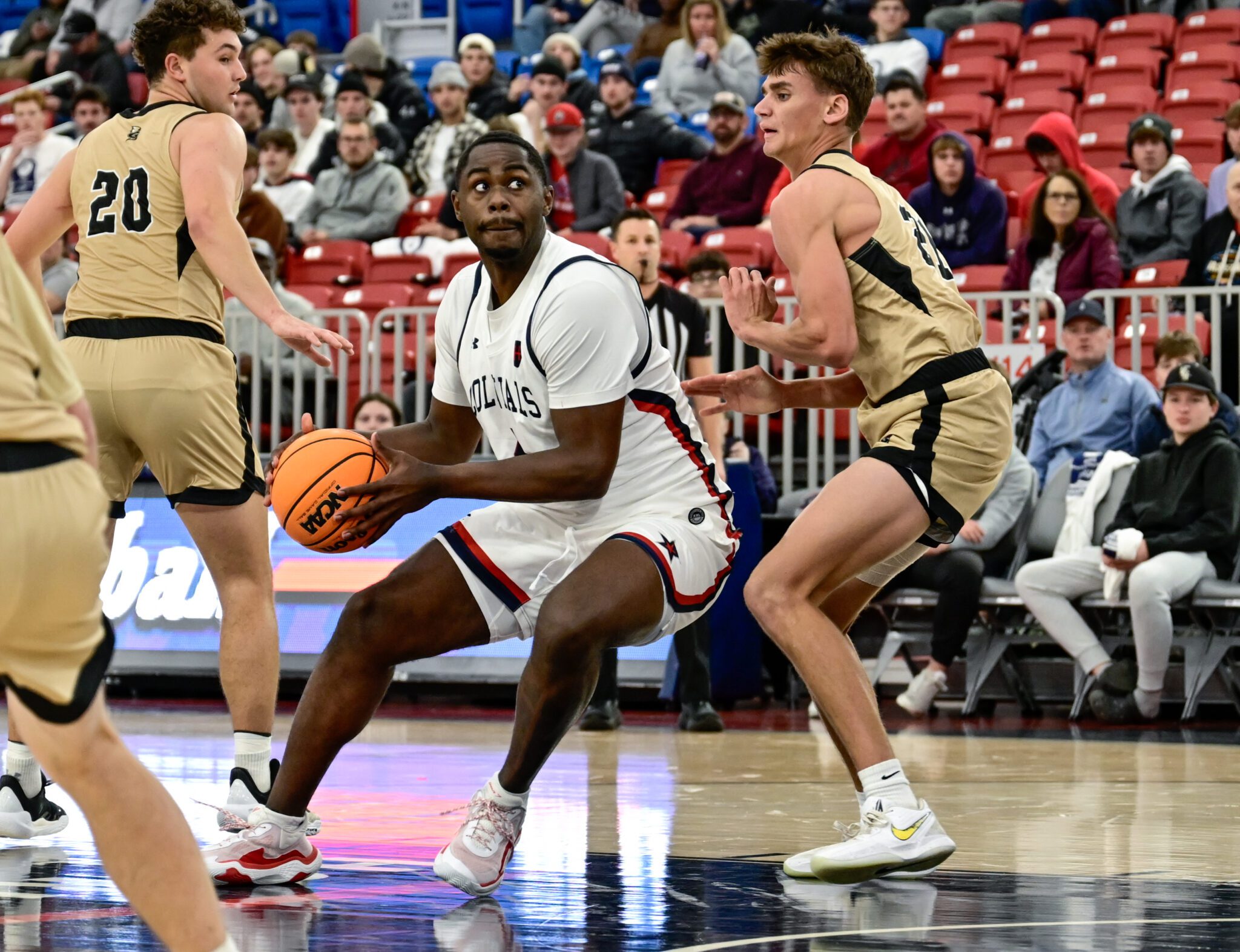 Robert Morris guard Kaleb Brown drives against a Geneva defender on Nov. 10, 2025 -- Ed Thompson / PSN