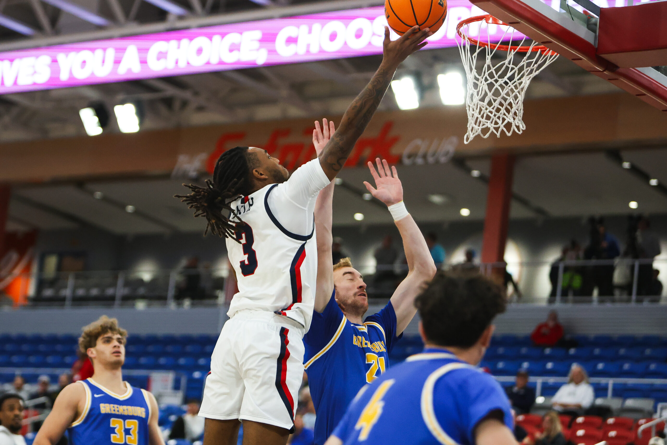 Robert Morris guard Ta'Zir Smith attempts a layup against a Pitt-Greensburg defender on Nov. 13, 2025 -- RMU Athletics