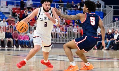 Robert Morris guard Ryan Prather Jr. drives against Detroit Mercy's Orlando Lovejoy in a game at the UPMC Events Center on Feb. 25, 2026 -- Ed Thompson // Pittsburgh Sports Now