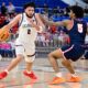 Robert Morris guard Ryan Prather Jr. drives against Detroit Mercy's Orlando Lovejoy in a game at the UPMC Events Center on Feb. 25, 2026 -- Ed Thompson // Pittsburgh Sports Now