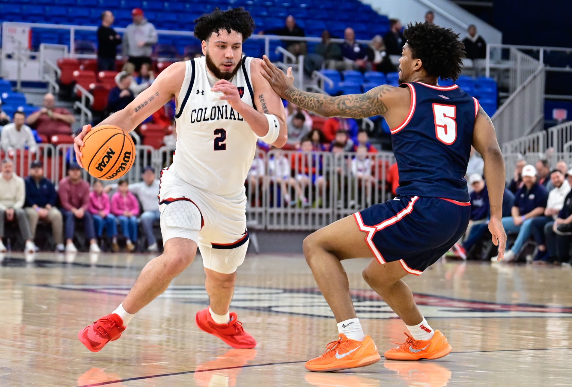 Robert Morris guard Ryan Prather Jr. drives against Detroit Mercy's Orlando Lovejoy in a game at the UPMC Events Center on Feb. 25, 2026 -- Ed Thompson // Pittsburgh Sports Now