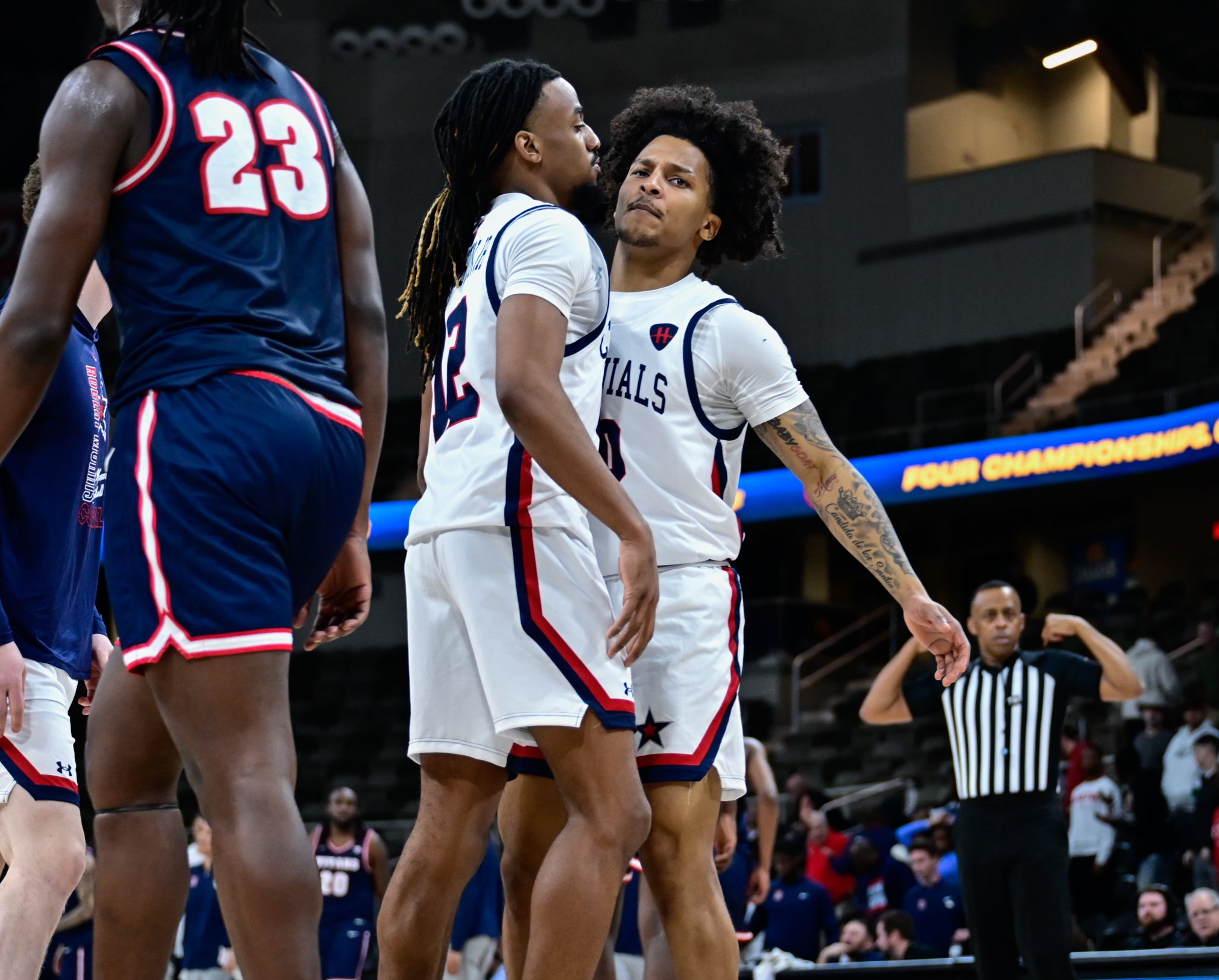 Robert Morris guards Darius Livingston Jr. and Albert Vargas chest bump during the Horizon League quarterfinal game against Detroit Mercy -- Ed Thompson // Pittsburgh Sports Now