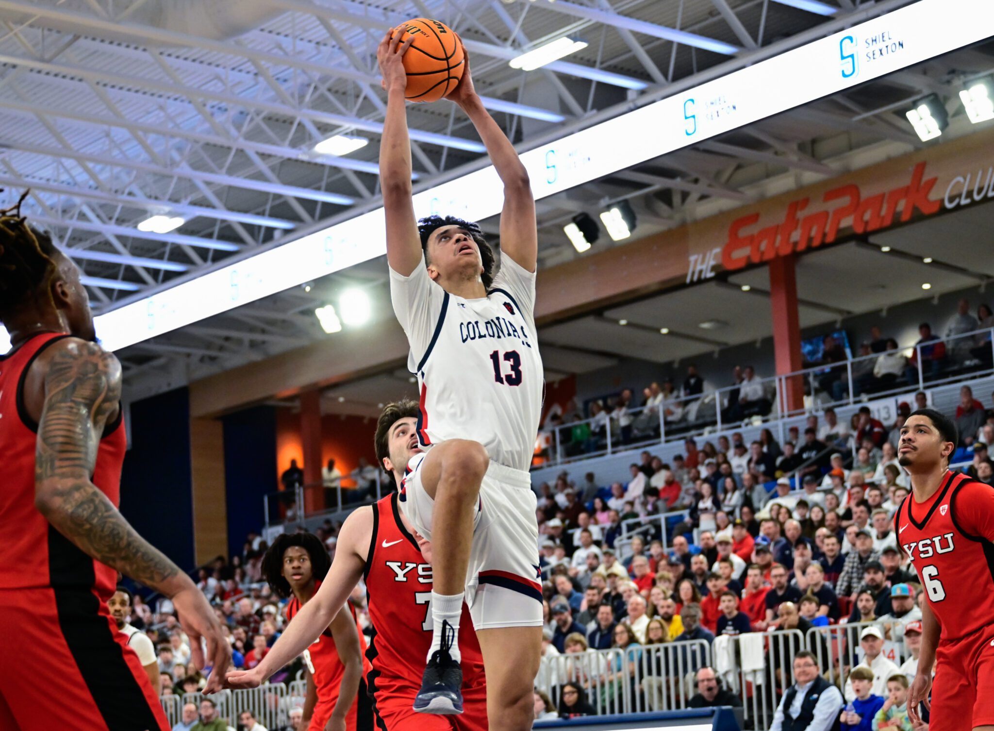 Robert Morris forward Samuel Obenjo throws down a dunk during the Horizon League quarterfinal matchup against Youngstown State — Ed Thompson // Pittsburgh Sports Now