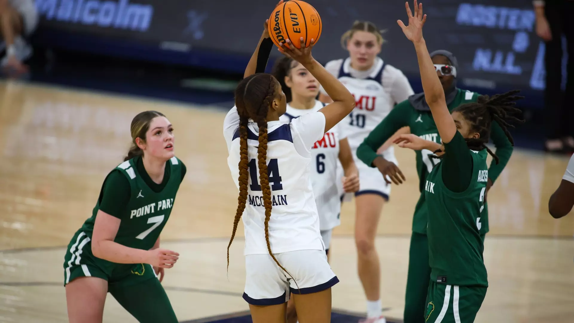 Robert Morris guard Dania McClain shots over a Point Park defender during the 2025-26 season -- RMU Athletics