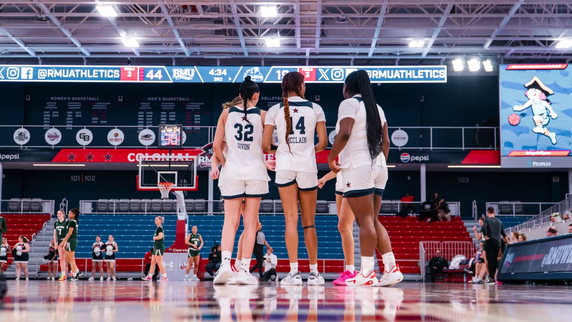 Robert Morris guards Noa Givon and Dania McClain, along with forward Layke Fields, huddle up during a game -- RMU Athletics