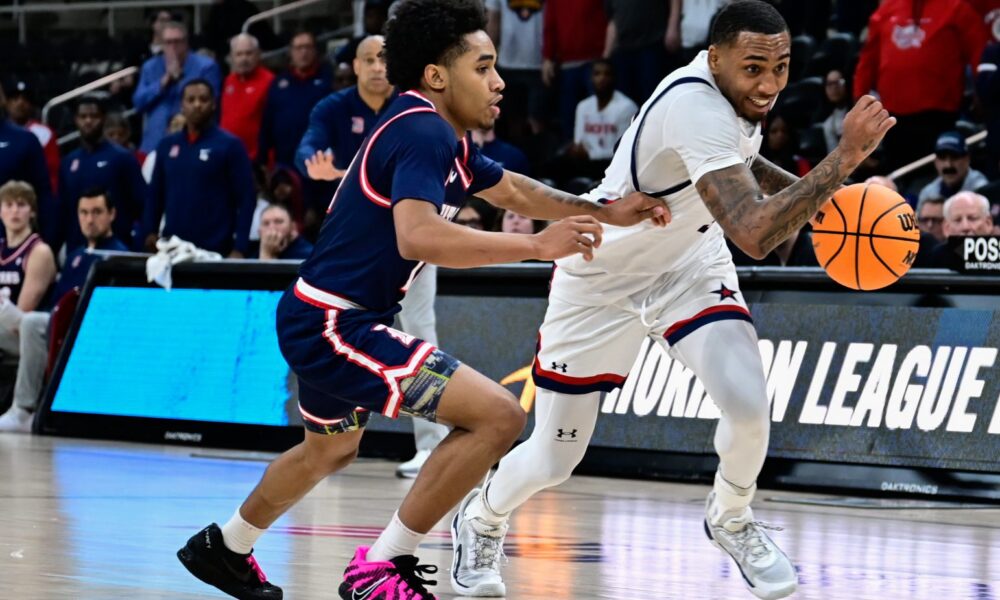 Robert Morris guard Ta'Zir Smith drives past a defender during the Horizon League semifinal game against Detroit Mercy on March 8, 2026 -- Ed Thompson // Pittsburgh Sports Now