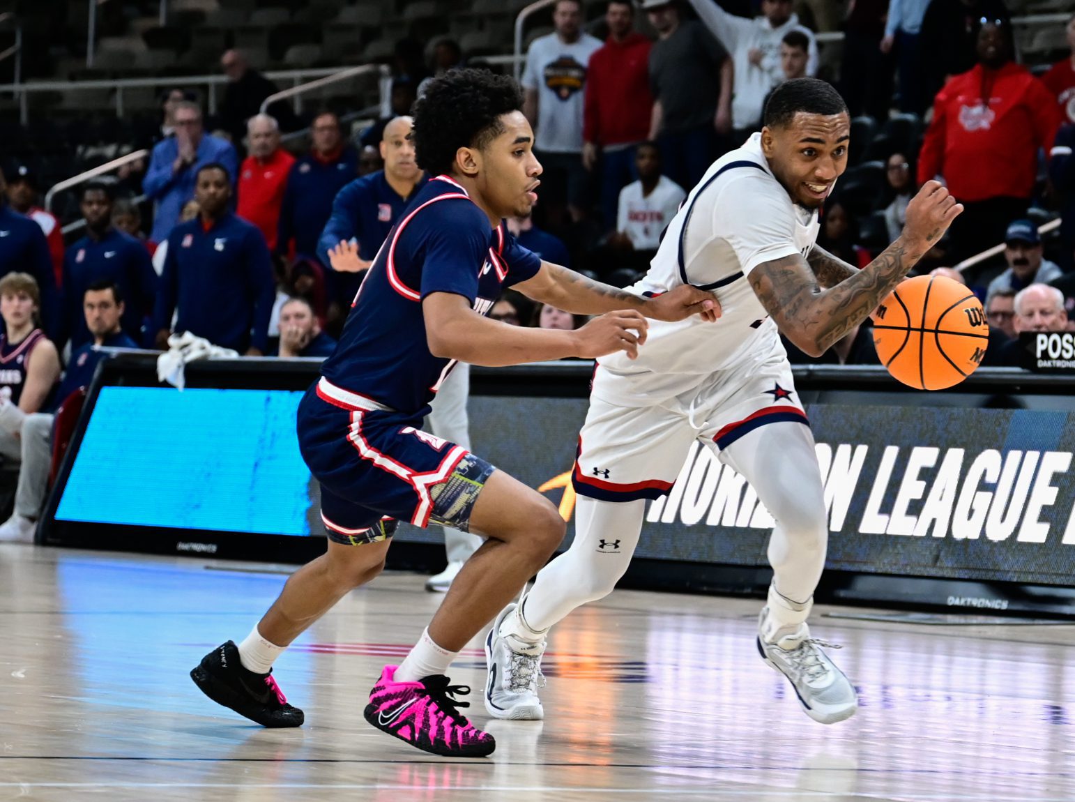 Robert Morris guard Ta'Zir Smith drives past a defender during the Horizon League semifinal game against Detroit Mercy on March 8, 2026 -- Ed Thompson // Pittsburgh Sports Now