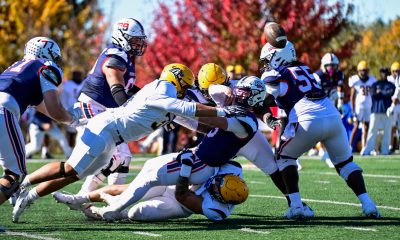 Robert Morris quarterback Carson Haggard tackled as he attempts a pass against New Haven on Oct. 17, 2026 -- Ed Thompson // Pittsburgh Sports Now